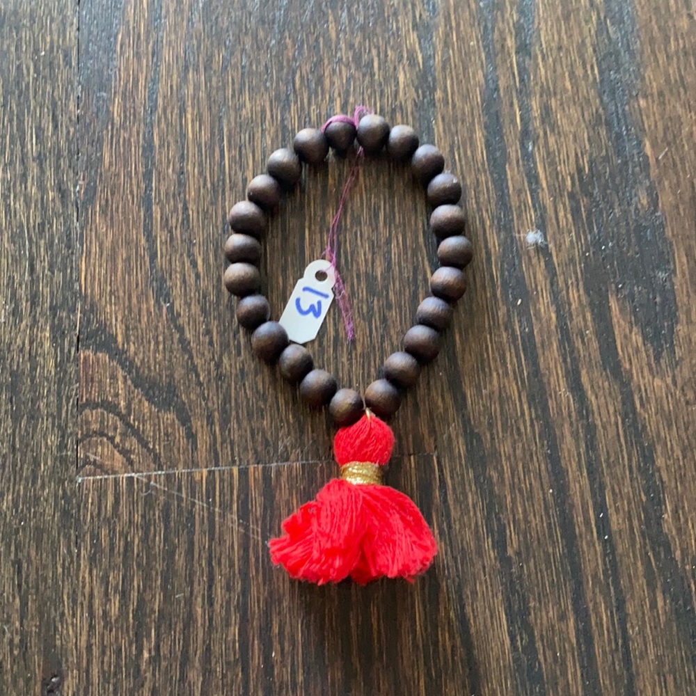 Brown Beaded Bracelet with red tassel
